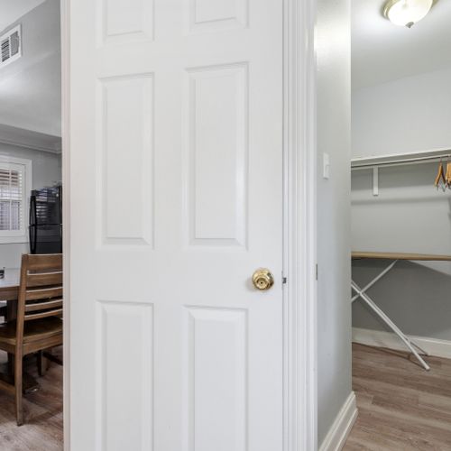 Roomy entryway w/ a classic white door & space to settle in.