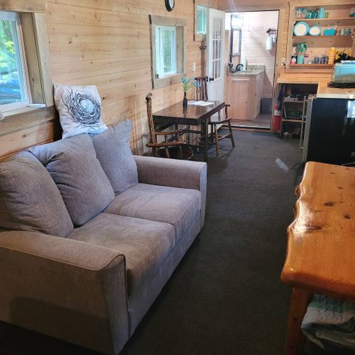 Overview:  the living room, dining table, and kitchenette.
