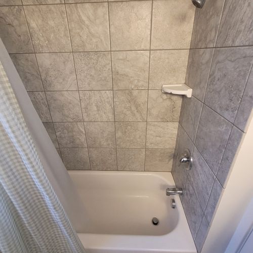 Bathroom #2:  full common bathroom on the main floor with a combination tub and shower.