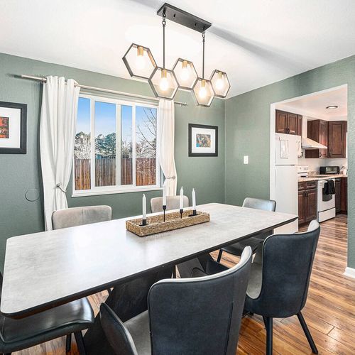 - gather around this stunning dining table for cozy breakfasts or lively dinners
- eye catching hexagon lighting sets the mood for unforgettable mealtime moments
- bask in natural sunlight with backyard views just steps from the kitchen
