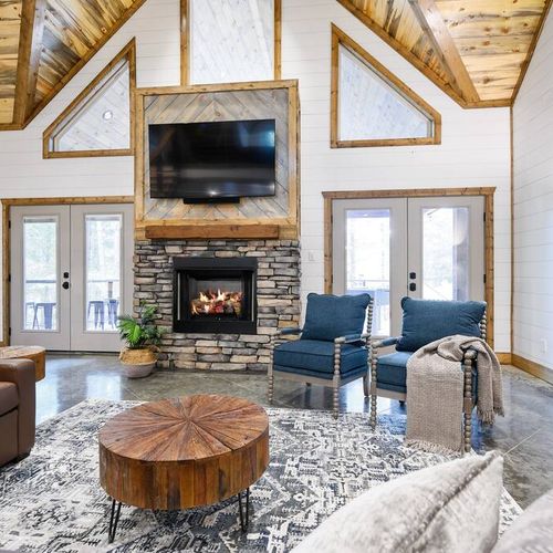 The heart of the living room is the stone fireplace and smart TV!