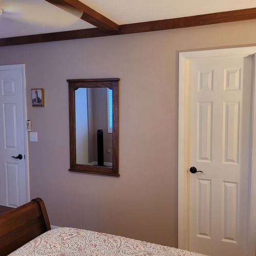 BEDROOM #1 (SECOND FLOOR):  Features a queen-size bed, nightstands, lamps, dresser, mirror, 2 closets, and its own private entrance to the bathroom on the second floor.