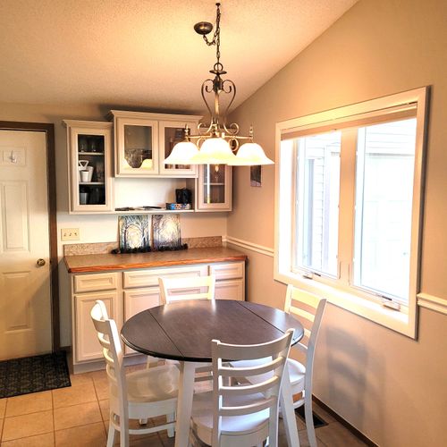 DINING AREA:  The home has a circular dining table with seating for up to 4 adults