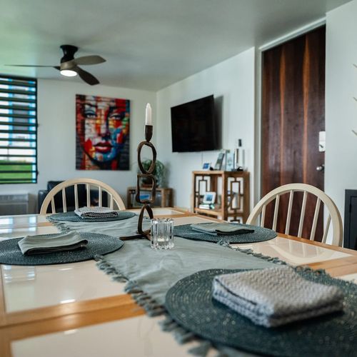 Enjoy modern living in this inviting space that combines dining and relaxation. Featuring stylish decor, a functional dining area, and a cozy lounge, it's designed for your comfort and enjoyment.