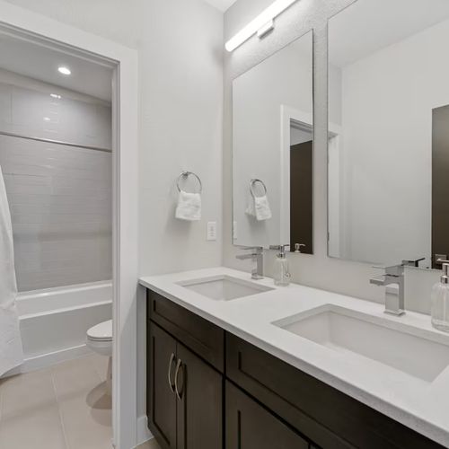 The tub, double vanities, and soft towels make this bathroom feel like your own private spa.