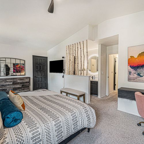 Step into a stylish master suite that epitomizes luxury and comfort. This sanctuary features tasteful decor, plush furnishings, and elegant touches throughout.