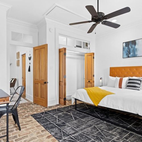 Super spacious bedroom 1 w/ a huge closet & dedicated desk for working in comfort.