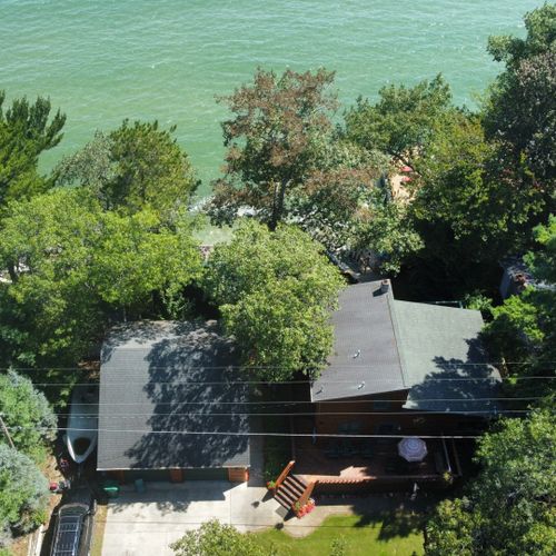 Exterior:  aerial view of the house and lake
