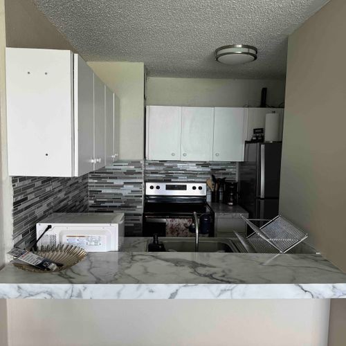 Chef's Delight Kitchen: Prepare delicious meals in this fully equipped, modern kitchen with top-of-the-line appliances.