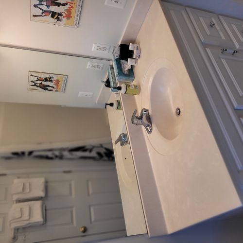 Bathroom #2 (upper level):  full bathroom that is a private en suite bathroom for bedroom #2