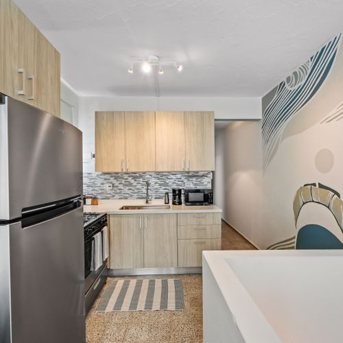 Seamlessly connecting the living area to the well-equipped kitchen.