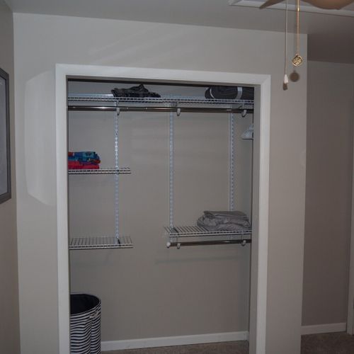 Bedroom #1:  features a queen-size bed, ceiling fan, and closet.