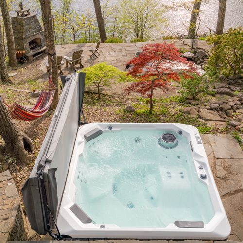 Looking down from the deck at the hot tub amid the terraced garden.