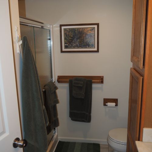 Bathroom:  full bathroom with a walk-in shower as well as a stacked washer and dryer.