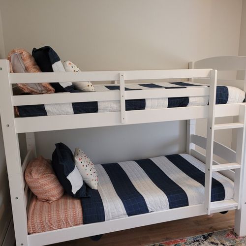 Bedroom #3:  bedroom #3 features a twin-on-twin bunk bed, ceiling fan, dresser, and closet.