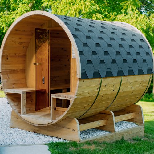 This backyard barrel sauna is a perfect place to unwind.