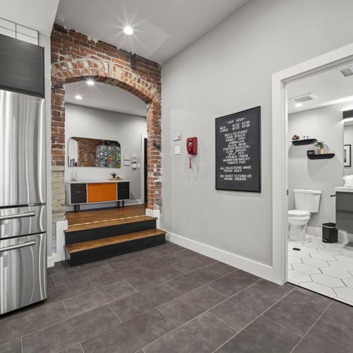 Entry area with steps leading into main living space and kitchen.