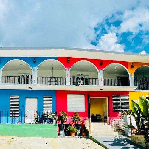 Welcome to your vibrant retreat! Our eye-catching building boasts a unique and colorful facade, making it easy to spot and inviting to arrive at.