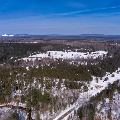 Exterior:  aerial view of the property with crystal mountain resort in the background.
