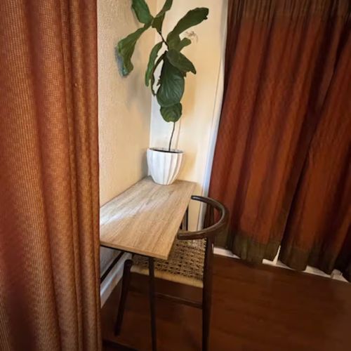A minimal desk with a touch of greenery for inspired work.