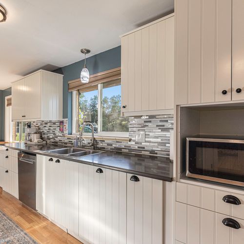 Cook while gazing at the peaceful tree-line view just outside.
