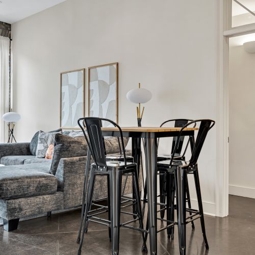 Intimate dining nook w/ modern chairs — perfect for a cozy meal in.