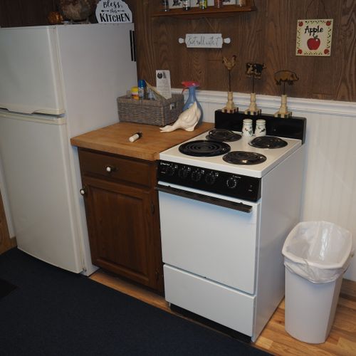 Kitchen:  full kitchen including sink, counter, cabinets, refrigerator, electric range and a good supply of cooking and dining utensils.