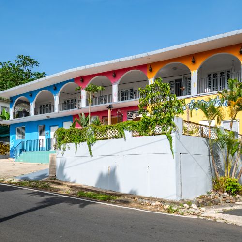 Vibrant guest house with a captivating, colorful facade.