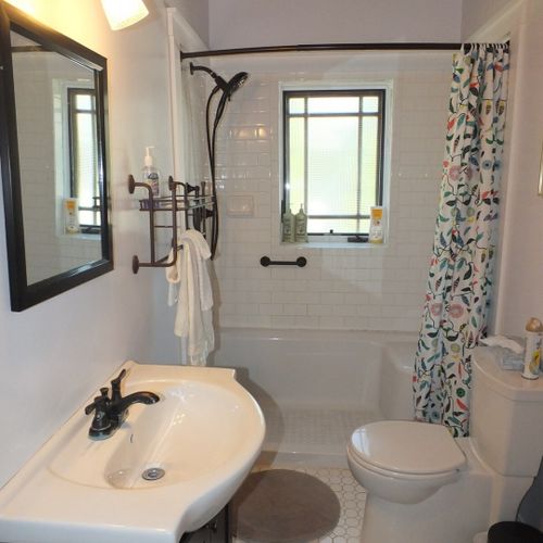 Bathroom #1 (first floor):  this is the main floor bathroom. It's a full bathroom that has been beautifully renovated and redecorated!