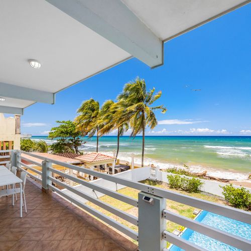 Fully equipped kitchen for home-cooked meals. Enjoy breakfast or dinner with natural light and a cozy island feel.