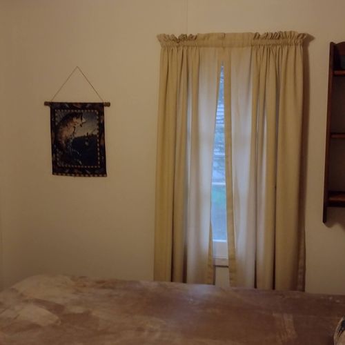 Bedroom #2:  features a full-size bed, nightstand, lamp, dresser. And closet.
