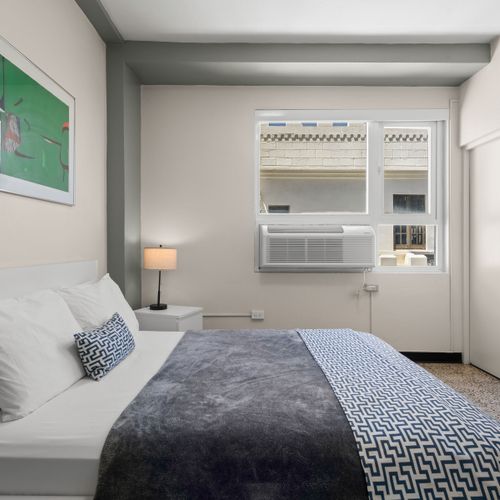 Enjoy the comfort of a queen-size bed and modern amenities for a perfect stay.