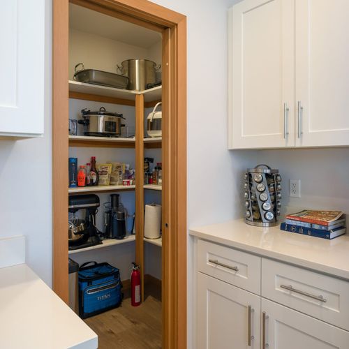 Just a few steps from the coffee area, you’ll find a pantry for easy access to storage and essentials during your stay.
