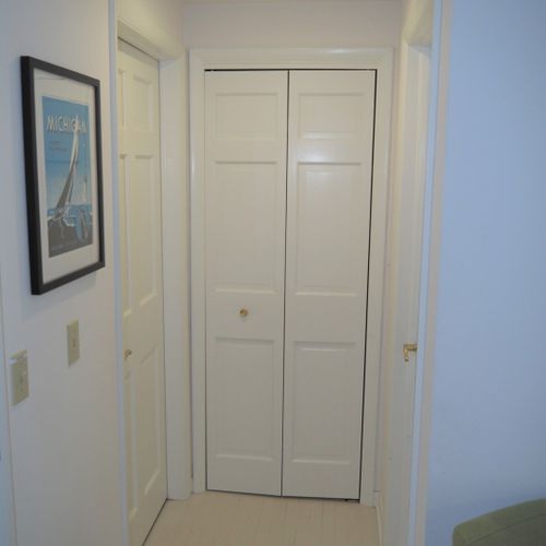 Hallway:  hallway going to the living room. The master bedroom (bedroom #1) is entered from the door on the left and it faces the back of the house. Bedroom #2 is entered from the door on the right and it faces the front of the house.