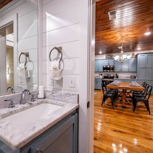 The half bath is found just off of the formal dining area!