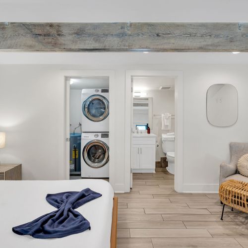 In-unit washer & dryer stacked neatly — laundry made easy during your stay.