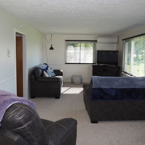 Living room:  the home has a comfy living room with new furniture and a nice view of manistee lake.
