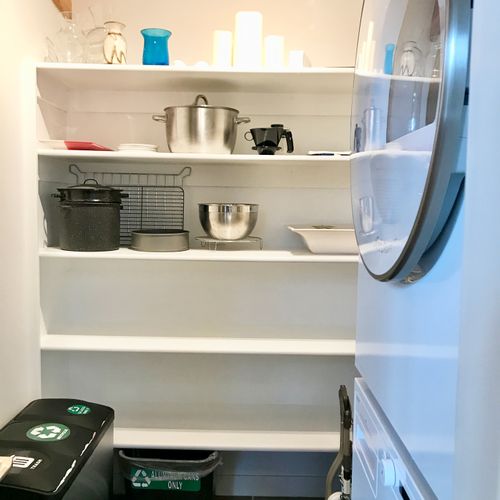 Asko Stackable washer and dryer is in the pantry located off of the kitchen.  Lots of storage space for food and personal items.