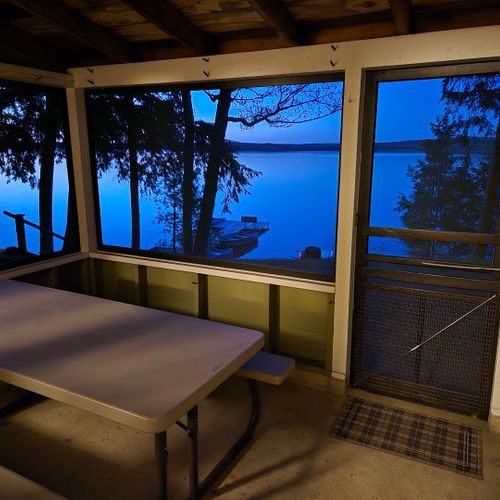 Front porch:  the cabin has a lovely screened-in porch with a picnic table and a great view of little platte lake