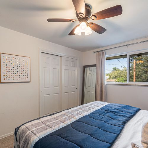 Enjoy the spaciousness and ample storage options provided by the dressers and closet with a full length mirror.