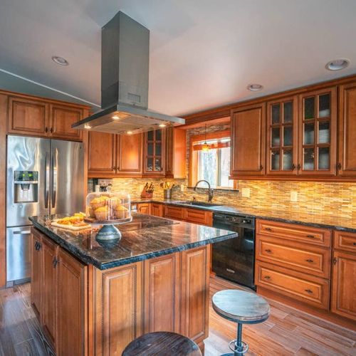 Chef's kitchen stocked with pots, pans and cooking basics.