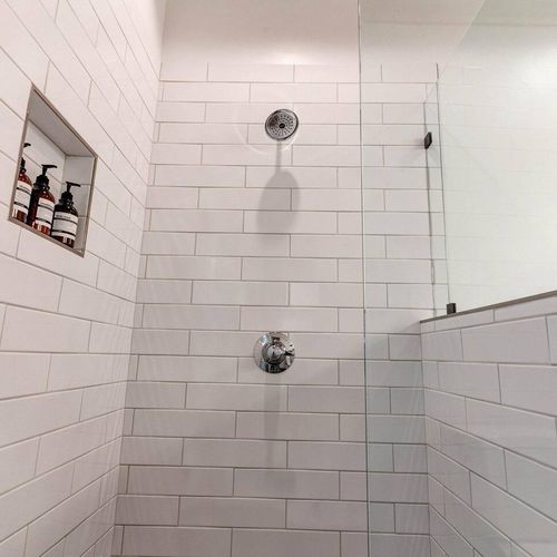 Bright bathroom w/ subway tile walls & a soaking tub for unwinding in style.