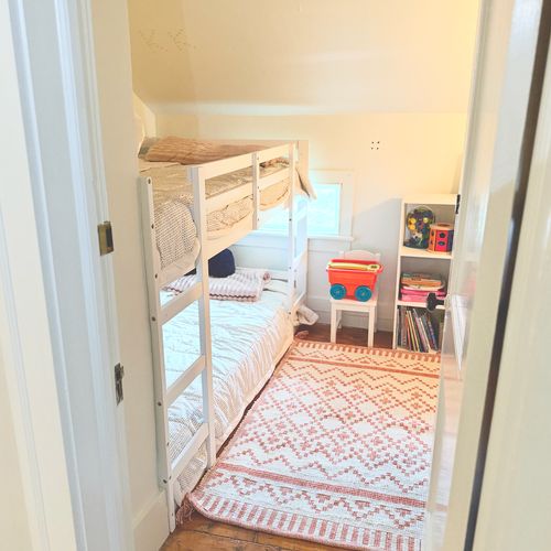 Looking into this cozy and cute bunk room.