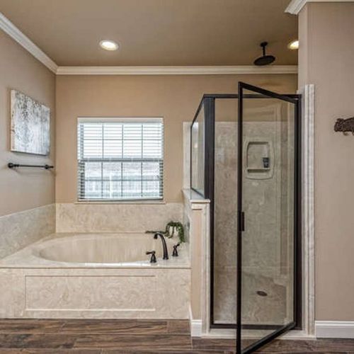 Master Bathroom - Soak, steam and slow down in this ensuite bathroom featuring a jetted tub, rainfall showerhead and private layout made for pampering after days on the town.