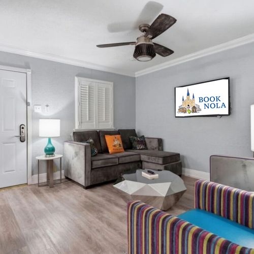 Relaxed lounge space w/ sectional seating & soft, neutral tones.