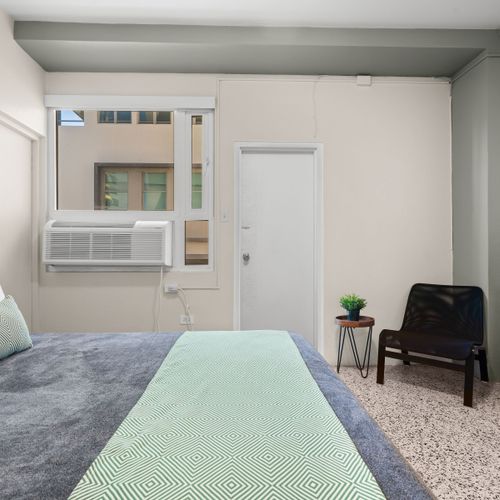 Experience peaceful nights in this bright and airy bedroom, where every detail contributes to a serene environment for your restful sleep.