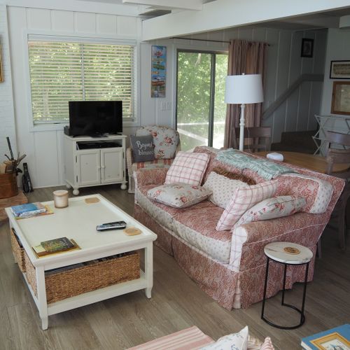 Living room:  comfy living room with great views of the lake and woods.