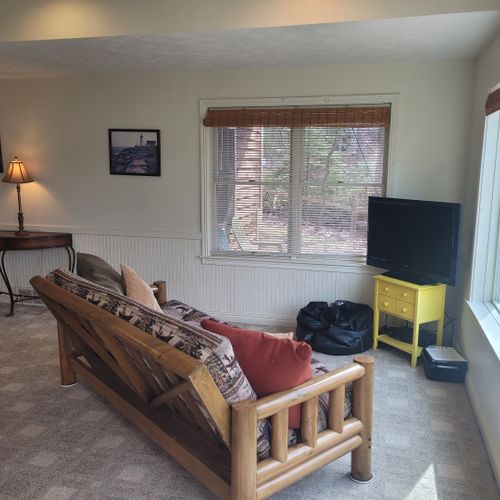 Gameroom (lower level):  the home has a fun gameroom on the lower level with a pool table, television with playstation2, and a sofa