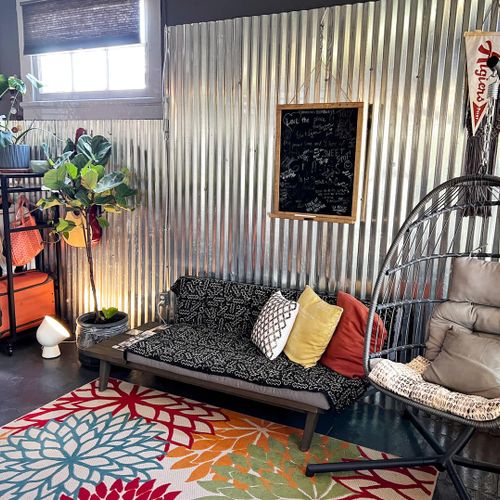 Bright, airy bedroom w/ eclectic decor that feels like a retreat within a retreat.