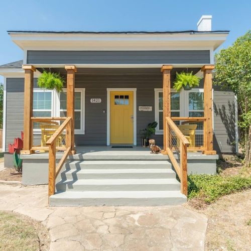 The bright and sunny porch of the main house with seating for morning coffee and quiet time.